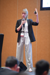Julia Köhler, Senior Structural Consultant at CREE GmbH, introduces the innovative "LifeCycle Tower" (LCT) system, a prefabricated timber-based construction approach challenging traditional building materials, regulations, and sustainability standards, with examples including Eunoia Junior College, an educational building in Singapore.