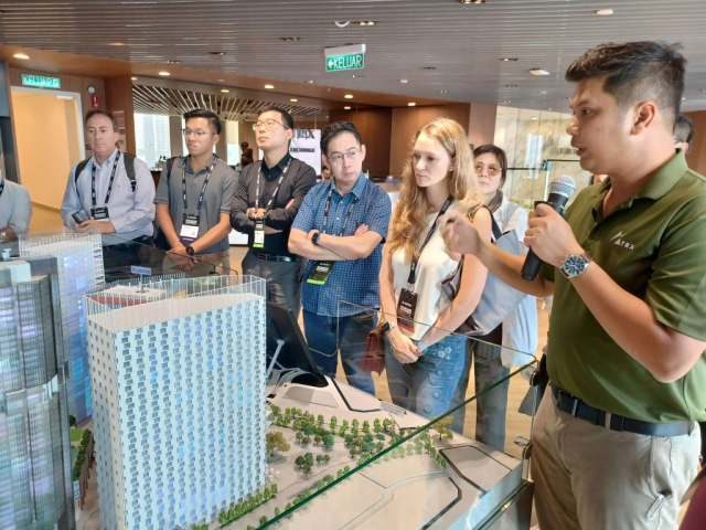 Tun Razak Exchange (TRX) Off-Site Program: Attendees toured Raintree Plaza, the northwest pedestrian gateway into Tun Razak Exchange, and TRX City Park, a lush rooftop park that is a multi-level and multi-experiential public venue The tour also included a visit to the TRX City headquarters office onsite and their development scale model. Image: Daniel Safarik